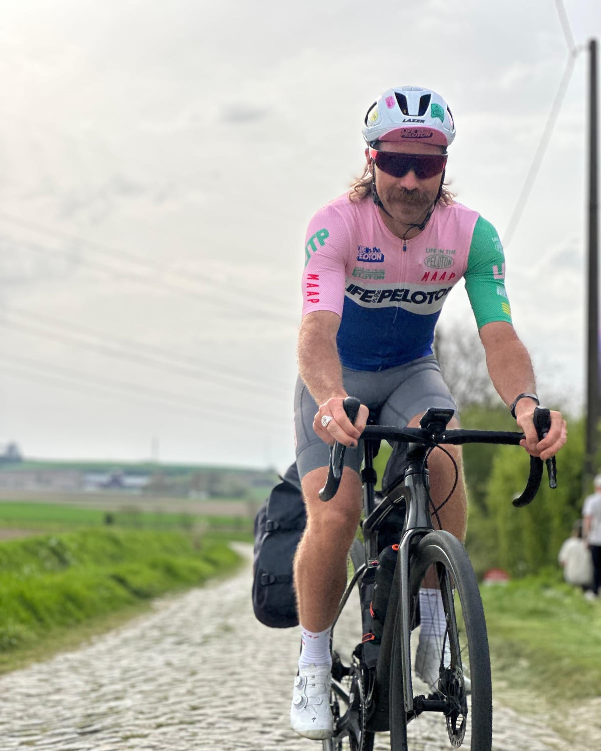 Mitch Docker riding cobbles in Life in the Peloton kit