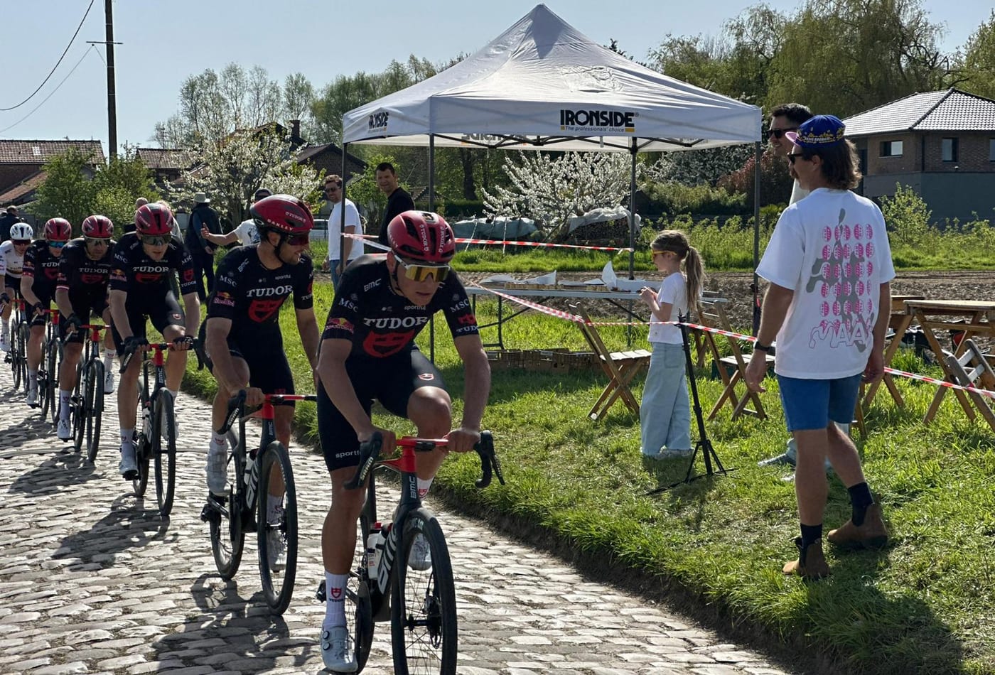 Mitch Docker watching professional riders on the cobbles